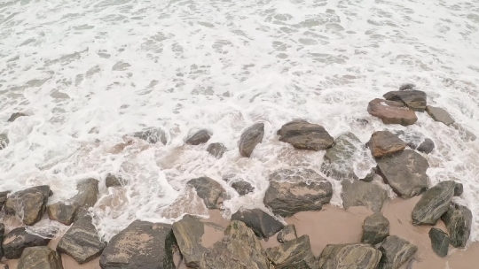 Beach waves over Rocks